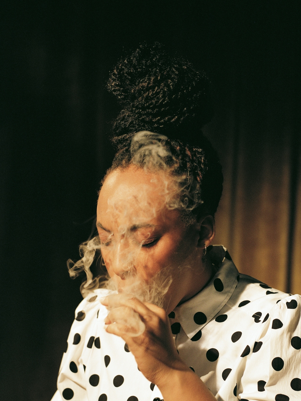 lady smoking up close with smoke
