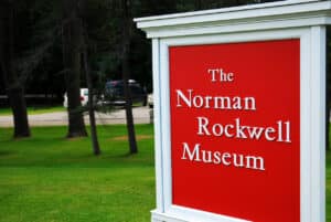 Stockbridge, MA, USA July 15, 2009 A large red sign welcomes visitors to the Norman Rockwell Museum in Stockbridge, Massachusetts